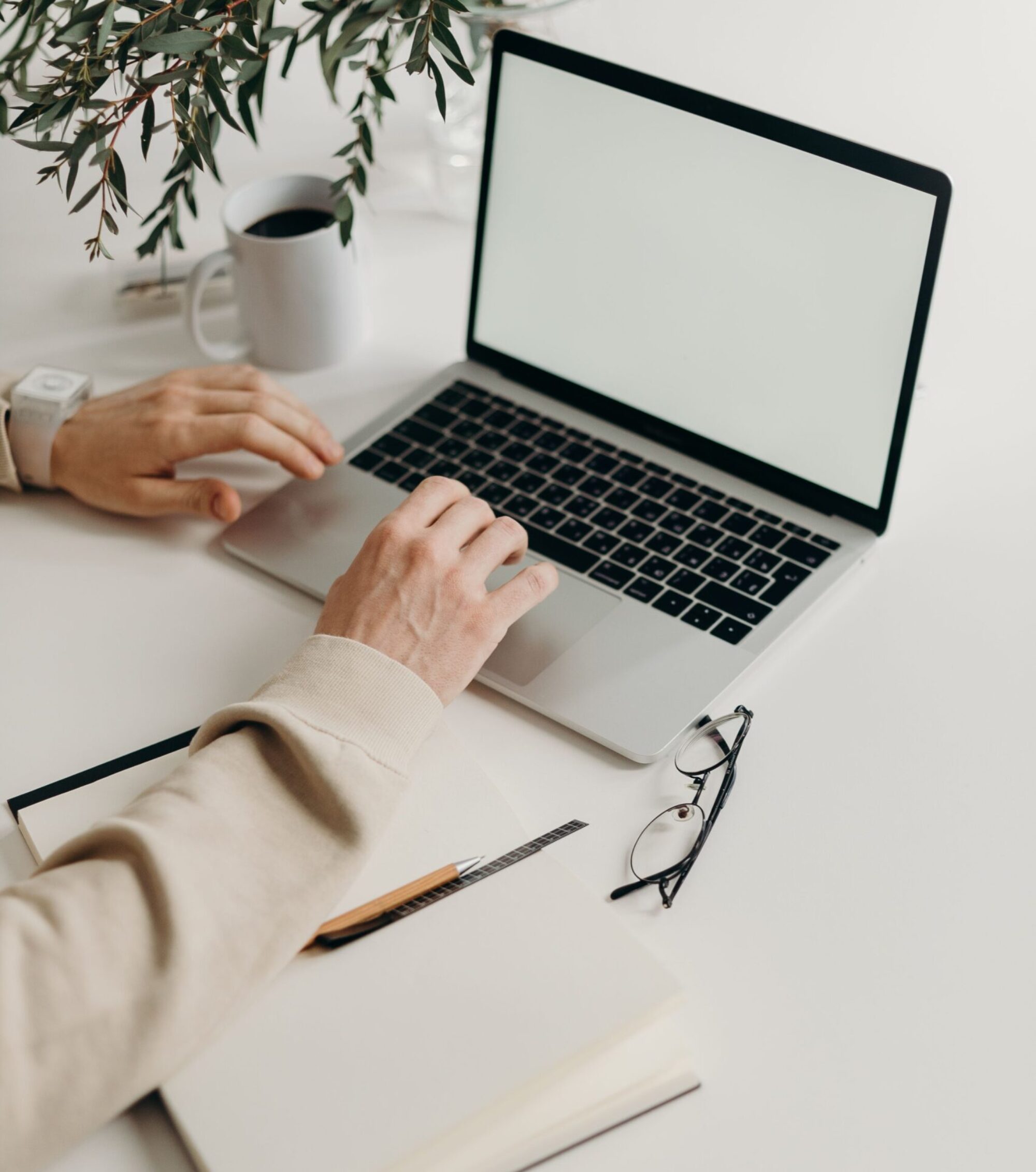 woman typing on a laptop